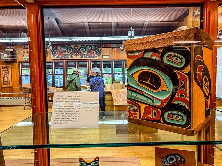 Woodcarver inside the visitor center at Sitka National Historical Park, featured on Exploring States.