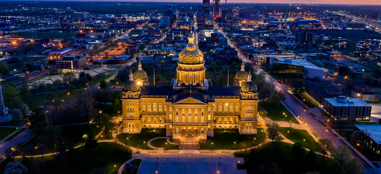 Panoramic view of the Iowa State Capitol building in Des Moines, featured on ExploringStates.